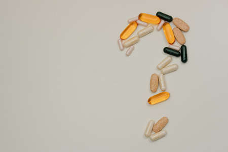 Multicolored pills on white backgroundの写真素材