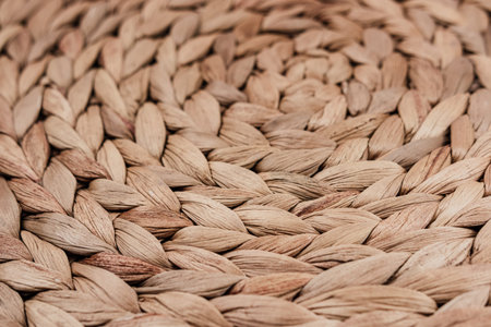 Beige natural mat of dry wicker grass as texture, background