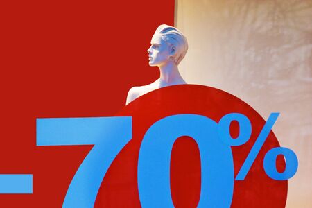 Undessed mannequin in show window with discount 70 percent symbolの写真素材