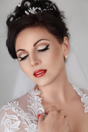Young beautiful bride in wedding dress and luxury coiffureの写真素材