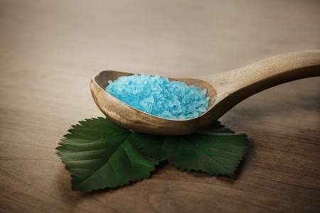 Potion of sea bath salt in wooden spoonの写真素材