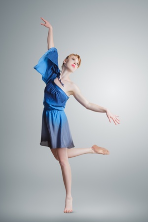 young beautiful ballerina training classic ballet dance in a classroomの写真素材