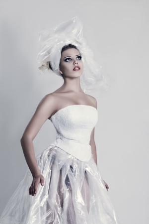 Fashion model wearing in polyethylene dress and hatの写真素材