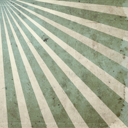 Abstract scratched grunge background with rays in vintage styleの写真素材