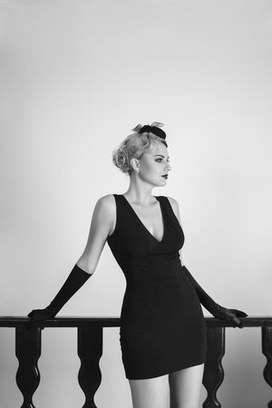 Elegant young fashion woman with evening retro style make-up and hairstyleの写真素材