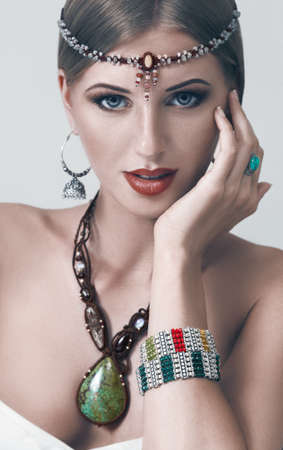 Young fashion woman posing with traditional indian jewelleryの写真素材
