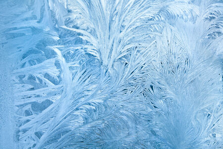 Abstract background of frost water on cold window glassの写真素材