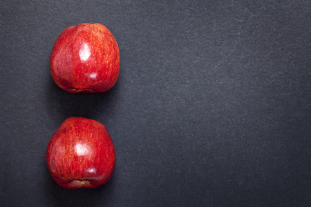Red fresh apples on dark gray backgroundの写真素材