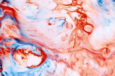 Abstract background of chaos blue and red ink in liquid paintの写真素材