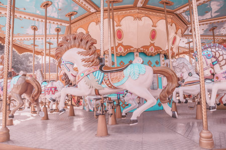 Vintage style empty carousel horse at playgroundのeditorial素材