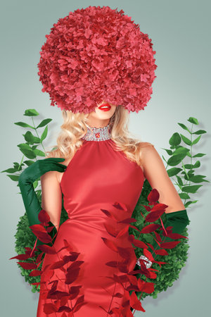 Captivating portrait of a beautiful young woman, her radiant face delicately encircled by an array of flowers.の写真素材