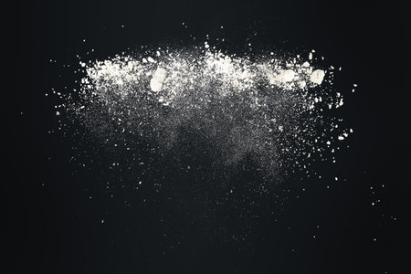 Abstract design of white powder snow cloud explosion on dark backgroundの写真素材