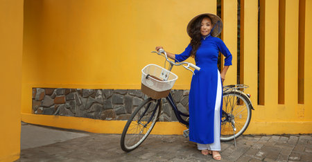 Portrait of young asian woman in traditional vietnamese dress ao dai in Vietnamの写真素材