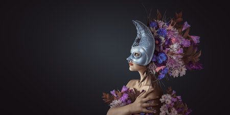 Woman wearing ornate Venetian mask and floral headdress. Themes of mystery, elegance, and carnival celebrations. For fashion, event promotion, or artistic projects.の写真素材