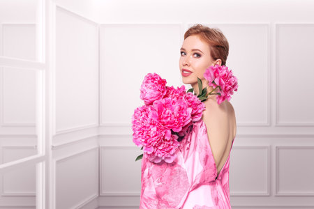 A serene and elegant woman embraces vibrant pink peony blooms, her face partially obscured behind the lush petals. Symbolizing femininity, natural beauty, and renewal. For cosmetics, fashion, or floral branding.の写真素材