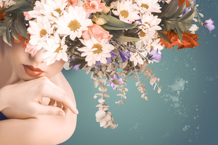 Ethereal beauty portrait featuring woman's face with floral arrangement of white daisies and mixed flowers. Perfect for beauty, cosmetics, spa advertising or fashion editorials.の写真素材