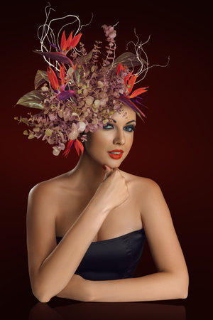 Artistic beauty woman portrait with flower arrangement. for fashion, beauty, spring campaigns, wedding aesthetics, and feminine lifestyle content.の写真素材