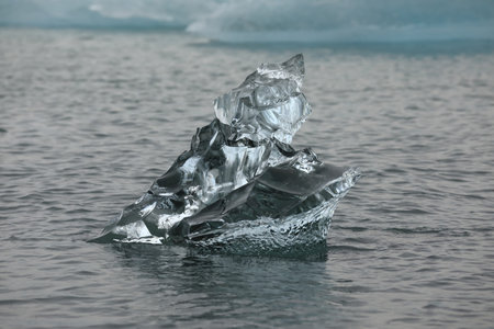 Chunks of glacier ice floating in the water. Diamond Beach, Iceland