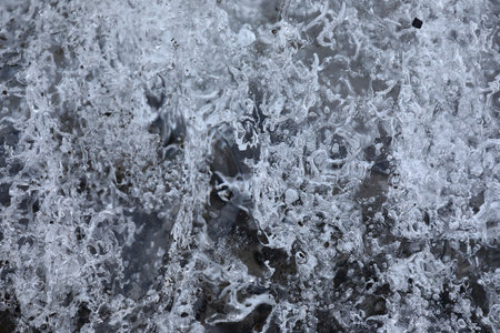 Details and bubbles on the ice of a glacierの写真素材