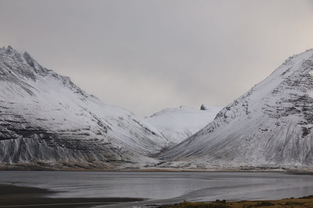 Snowy mountain, sea and beach