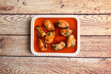 Ration of pickled mussels on wooden tableの写真素材