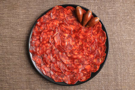 Portion of 100% acorn-fed Iberian chorizo from Extremadura decorated with acornsの写真素材