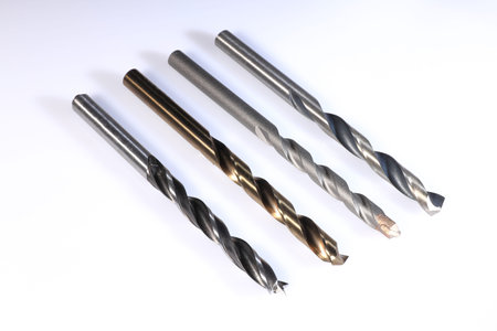 Set of various drill bits with white background
