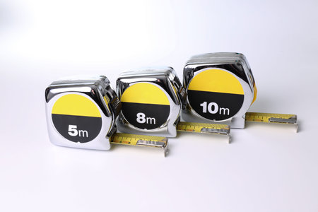 Flexometers or measuring tapes on white background