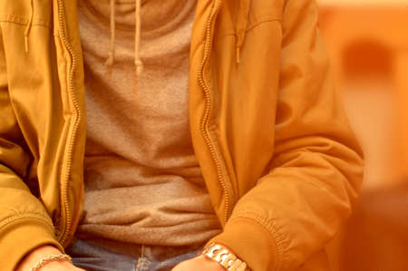 Young man dressed in yellow jacketの写真素材