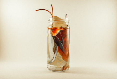 Leafs in jar full of water and added some ink