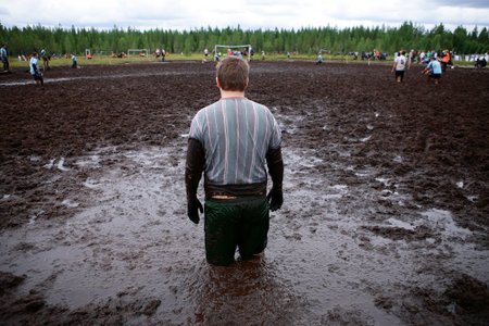 Goalkeeper standing in the swamp during the World Cup soccer Swamp, Ukkohalla, Finland 2013
