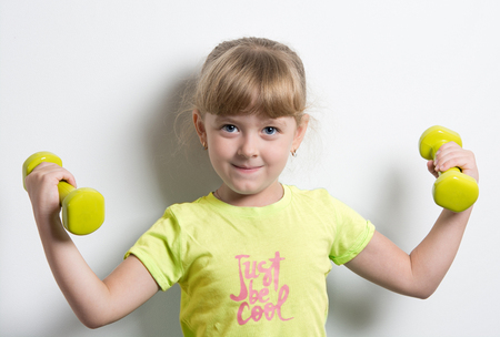 little funny girl with a bright weightsの写真素材