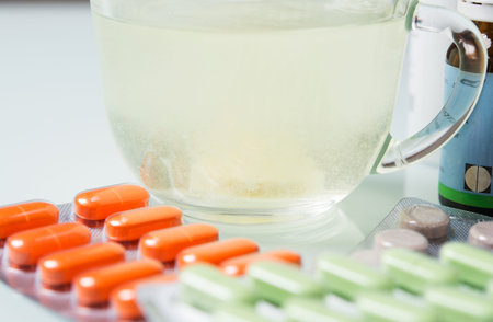 different colored pills on the tableの写真素材