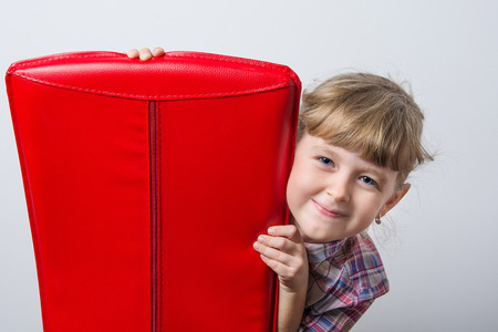 cute baby with red chairの写真素材