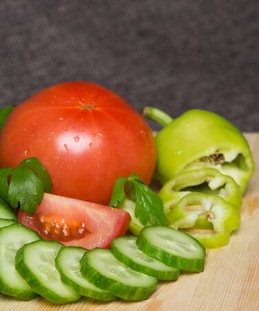 cucumbers with tomatoes and peppersの写真素材