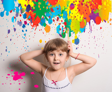 naughty young artist with bright colorsの写真素材
