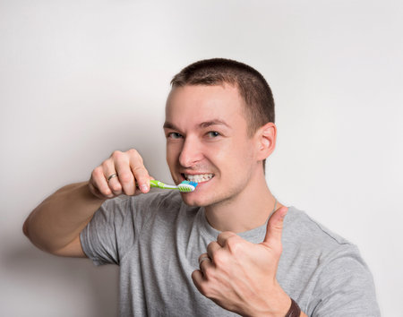 man cleans morning teethの写真素材