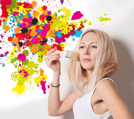 woman in the midst of colorful splashesの写真素材