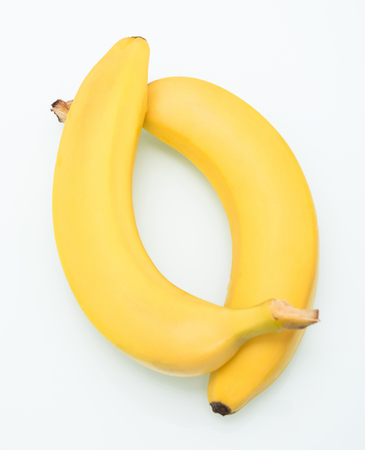 appetizing ripe yellow banana on white backgroundの写真素材