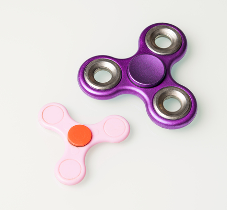 two bright spinner on a white backgroundの写真素材