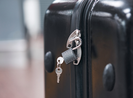 black suitcase at the airportの写真素材