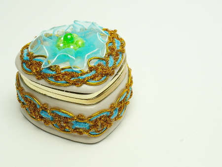 A small box for decorations is decorated a bow and beadの写真素材