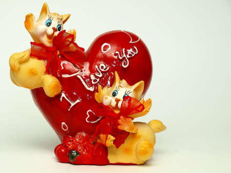 Two cats near a heart on which are written の写真素材