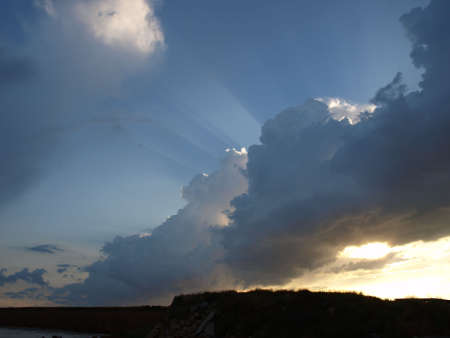 Rays of a sun waning for a cloudの写真素材