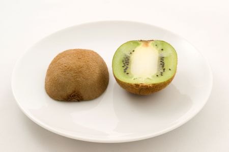 Kiwi at white plateの写真素材
