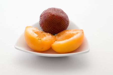 Half of Apricots and strawberryの写真素材