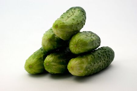 Green cucumbers, close-up on a white backgroundの写真素材