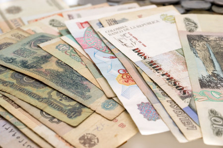 Coins and banknotes (numismatic collection) around separately closeup