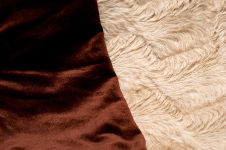 The background of textured brown and light synthetic fabric closeupの写真素材