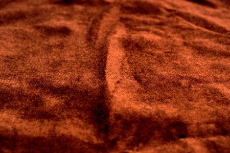 The background of textured brown synthetic fabric closeupの写真素材